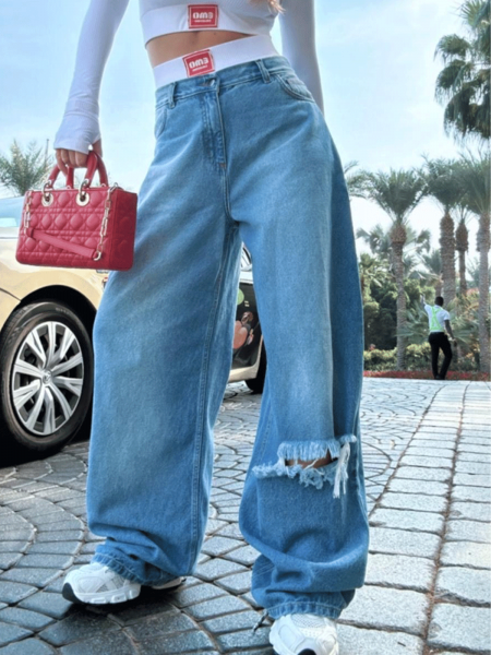 Spodnie jeansy z szerokimi nogawkami z dziurą VELARIA - jeans